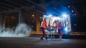 Paramedics loading a patient in an ambulance