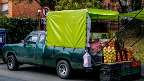 A man selling produce out of truck