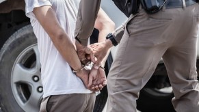 A police officer arresting man