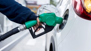 A man putting gas in his car