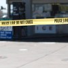 Police tape at a gas station