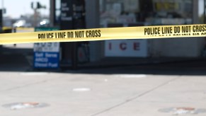 Police tape at a gas station