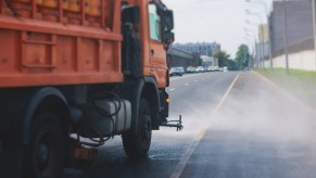 A flusher truck cleaning the street