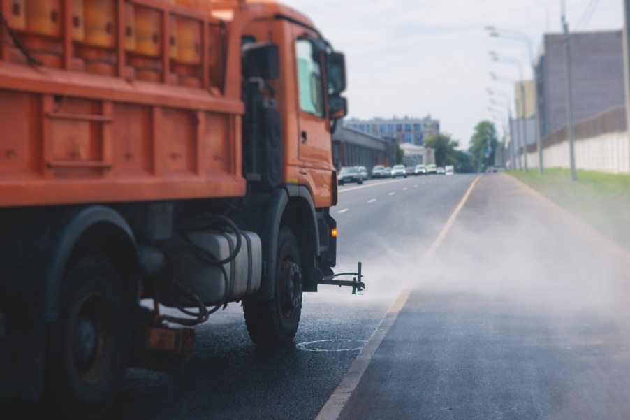 A flusher truck cleaning the street