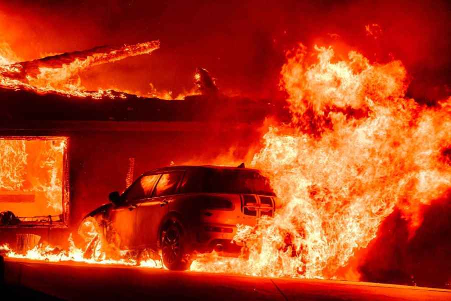 A car on fire during the Los Angeles County fires of 2025