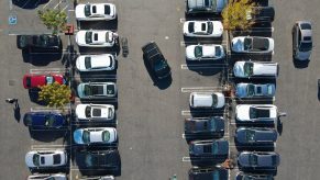 Aerial view of a parking lot with cars