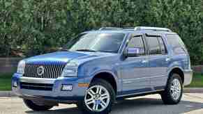 A blue 2009 Mercury Mariner parked in left front angle view