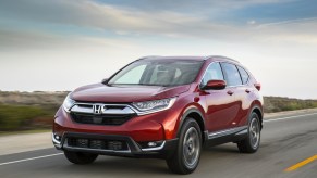 A red 2017 Honda CR-V driving