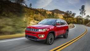 A red 2021 Jeep Compass driving