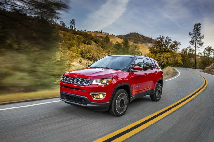 A red 2021 Jeep Compass driving