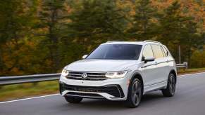 A white 2022 Volkswagen Tiguan SUV driving