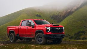 The 2024 Chevy Silverado 2500 off-roading in the mud