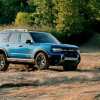 The 2025 Ford Bronco Sport drives on a dirt track.