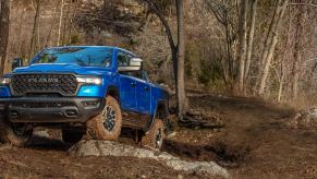 The 2025 Ram 1500 off-roading in the woods