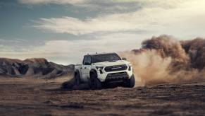 A 2025 Toyota Tacoma off-roading in mud