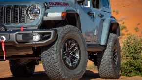 A blue-gray 2025 Jeep Wrangler Rubicon parked in close left front angle view