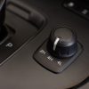 A 4WD to 2WD setting knob in a car's interior in close view