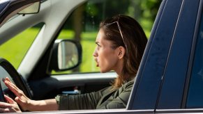 A driver screams and honks with road rage.