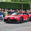 Red Bugatti Chiron hypersport in Molsheim France, a crowd visible in the background.