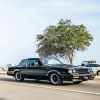 Black Buick Grand National "GNX" trim driving down a highway