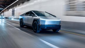 A Tesla Cybertruck rolling through a tunnel.