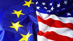 Two flags represent a trade imbalance between European and American cars.