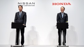 The Nissan CEO and Honda CEO on stage