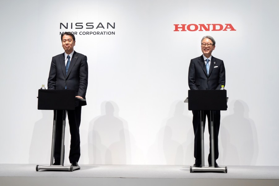 The Nissan CEO and Honda CEO on stage