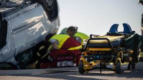 A full-size SUV in a bad rollover wreck.