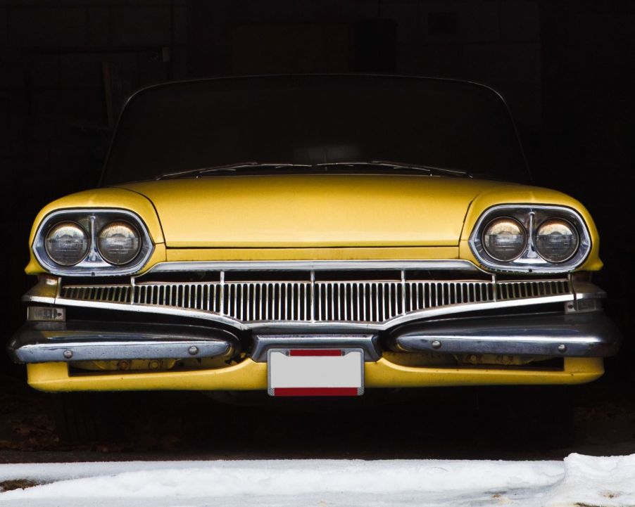 A classic car in a garage or storage unit