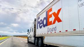 A FedEx semi-truck on a highway