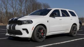 A white 2021 Dodge Durango Hellcat SUV with black racing stripes