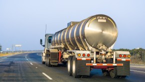 A tanker truck hauling a load on the highway