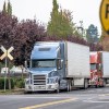 Semi-trucks at a railroad crossing