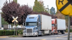 Semi-trucks at a railroad crossing