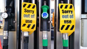 Fuel pumps at gas station with out of order signs