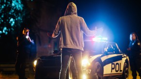 A man being arrested by two police officers