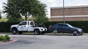 A tow truck towing a car