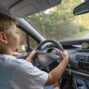 A child driving an SUV