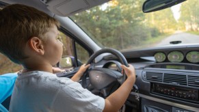 A child driving an SUV