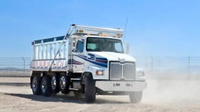 A dump truck in the dirt