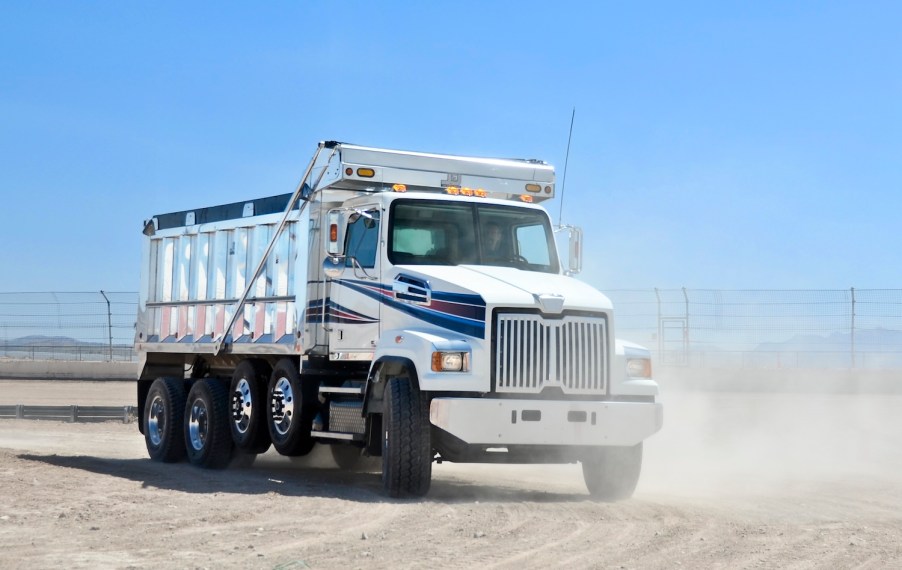 A dump truck in the dirt