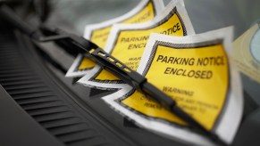 Parking tickets on a car windshield