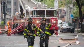 Two New York firefighters in the street