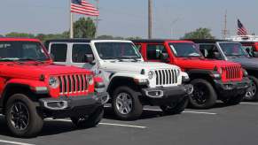 Jeep Wrangler SUVs parked at a U.S. dealership lot