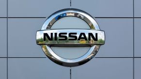 A Nissan badge at a dealership