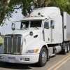 An example of one of the Office of Secure Transportation's Ghost Trucks, an unmarked white semi-truck parked in left front angle view