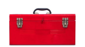 A red metal toolbox representing Milwaukee Tool sits on a white background