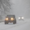 A Jeep Wrangler driving in the snow