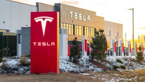 A Tesla dealership with a dusting of snow